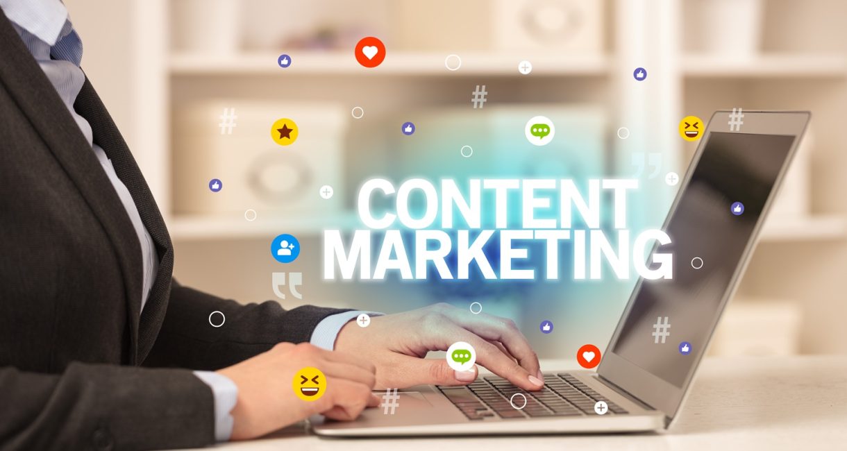 Freelance woman using laptop with CONTENT MARKETING inscription, Social media concept